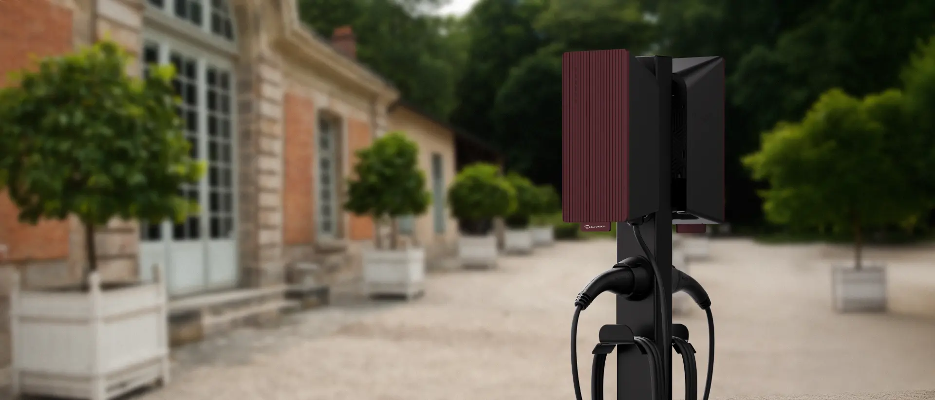 Teltonika EVC2 EV Charger mounted on a stand in front of a home