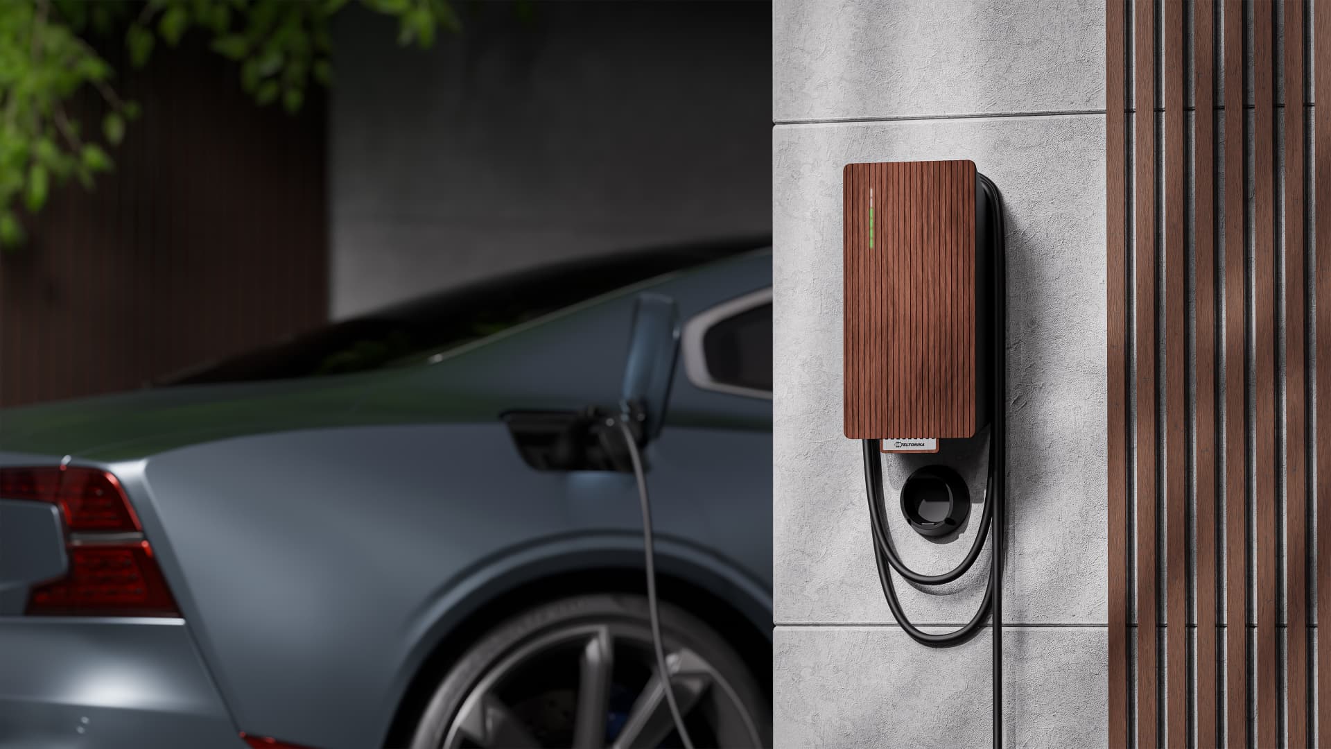 Teltonika EVC2 EV Charger mounted on a stone wall beside a charging car