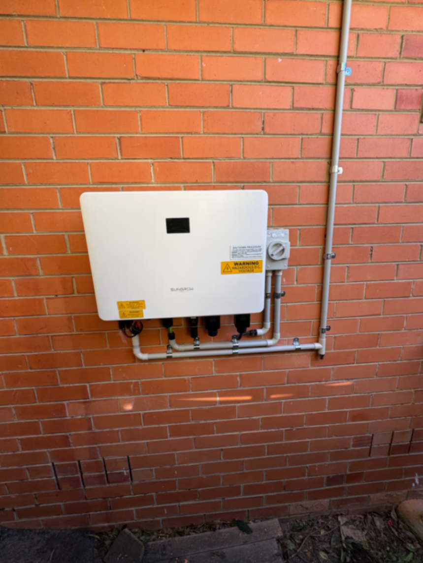 Sungrow inverter installed on brick wall